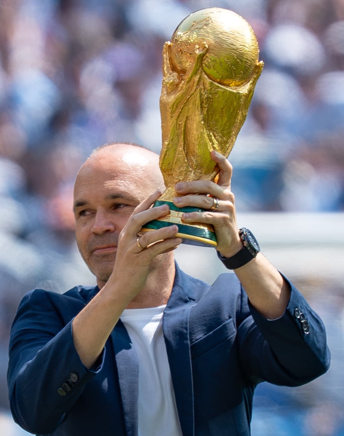 Andrés Iniesta lifting the World Cup trophy